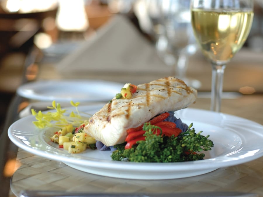 Photo of a fish dinner with wine