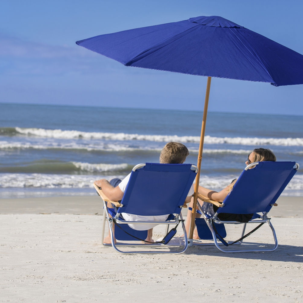 Couple under a parasol on the beach